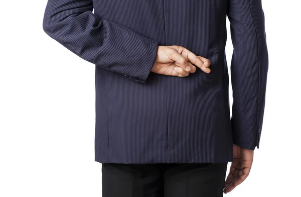 Businessman with fingers crossed — Stock Photo, Image