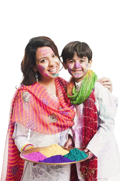 Woman celebrating Holi festival with her son — Stock Photo, Image