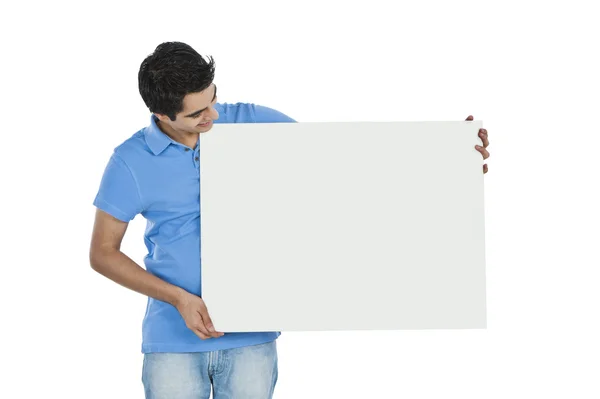 Man looking at a whiteboard — Stock Photo, Image