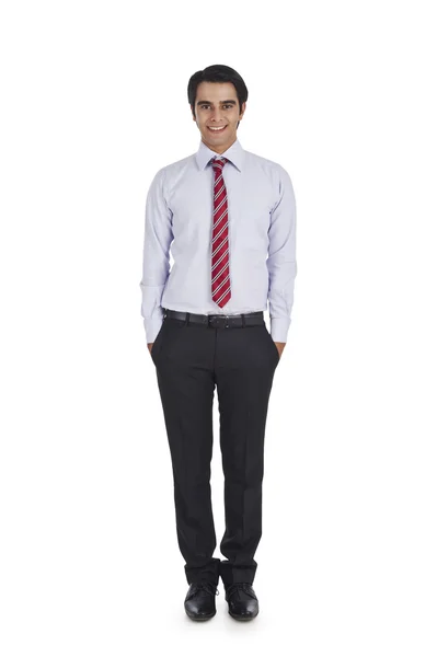 Businessman with his hands in pockets — Stock Photo, Image