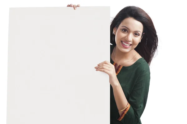 Happy woman holding a whiteboard — Stock Photo, Image