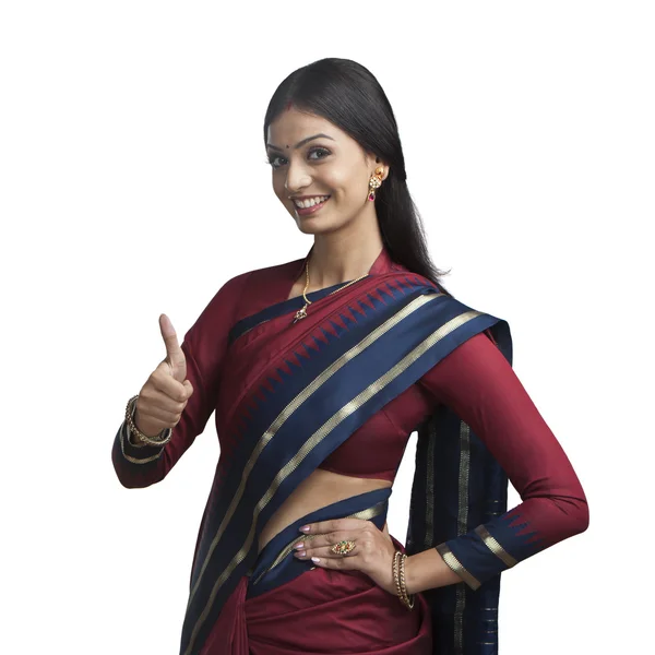 Indian woman gesturing thumbs up sign — Stock Photo, Image