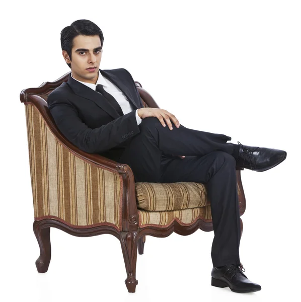 Businessman sitting in an armchair — Stock Photo, Image