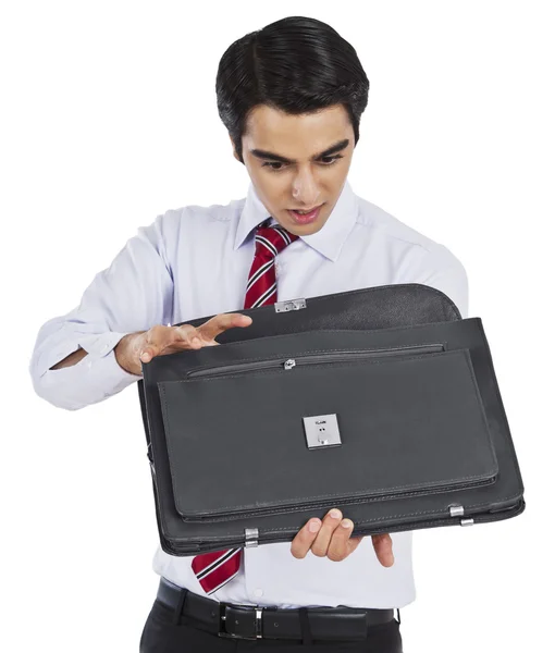 Businessman looking into his bag — Stock Photo, Image