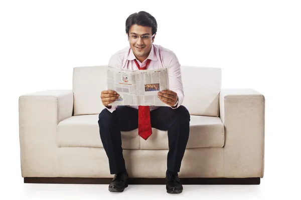 Businessman reading a newspaper — Stock Photo, Image