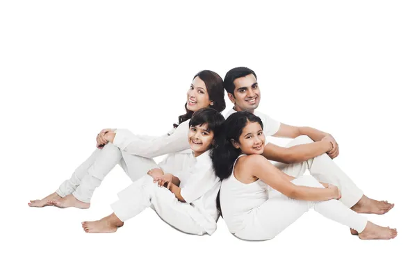 Happy family sitting together — Stock Photo, Image