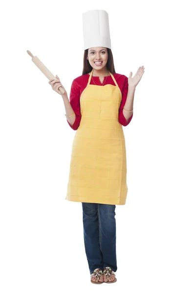 Happy woman holding a rolling pin — Stock Photo, Image