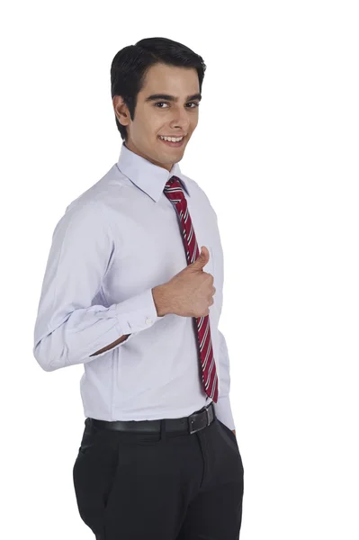 Businessman showing thumbs up sign — Stock Photo, Image