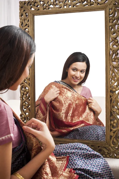 Reflection of a woman in mirror — Stock Photo, Image