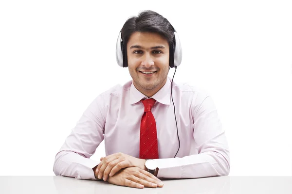 Businessman listening to music — Stock Photo, Image