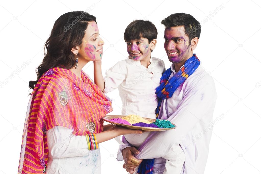 Family celebrating Holi festival