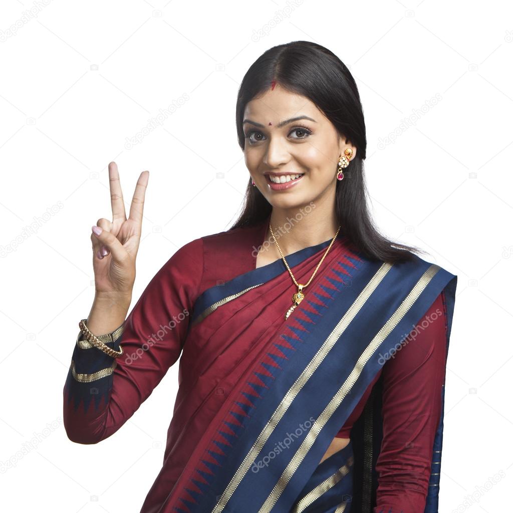 Indian woman gesturing victory sign