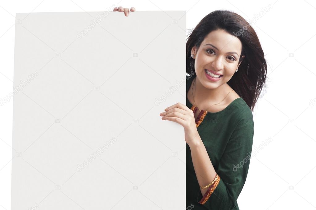 Happy woman holding a whiteboard