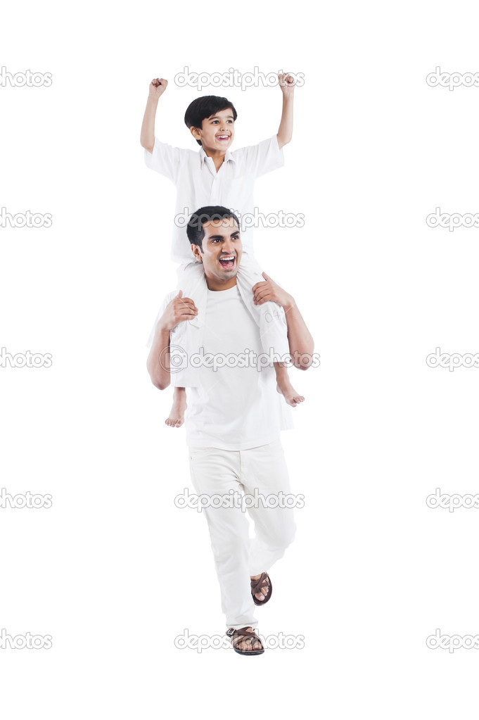 Man carrying his son on shoulders
