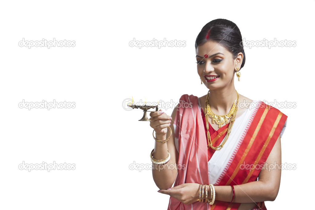 Woman holding oil lamp