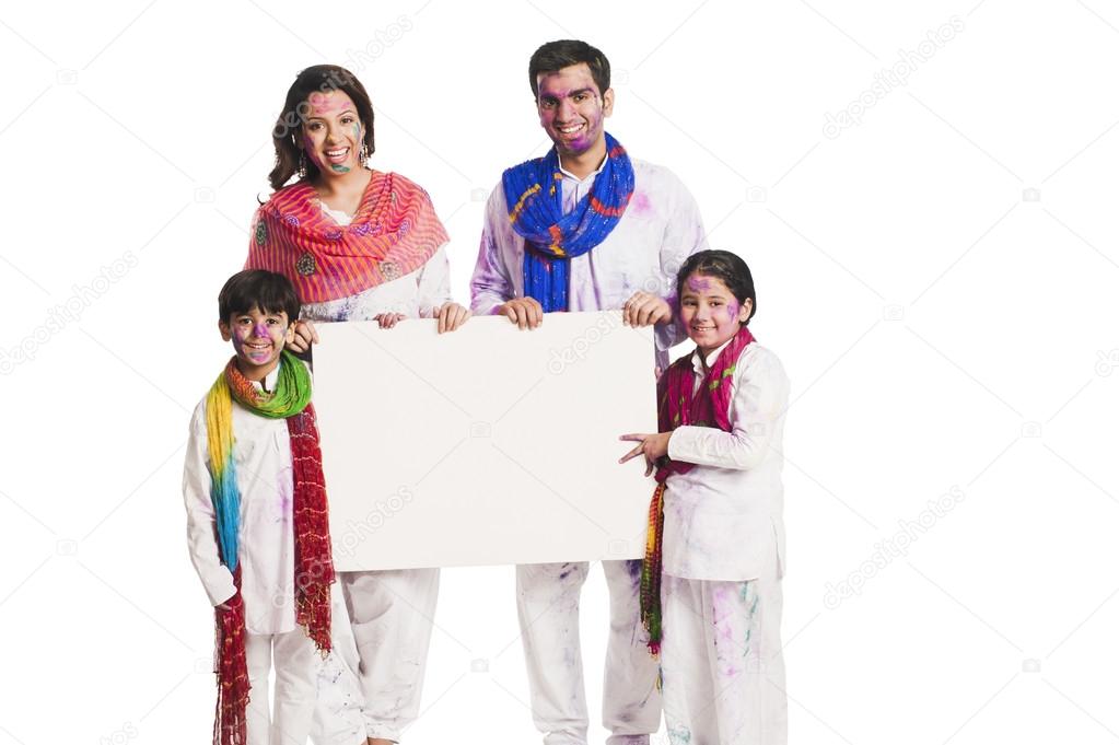 Family celebrating Holi