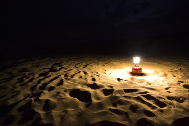 Lantern on sand dune, Jaisalmer clipart