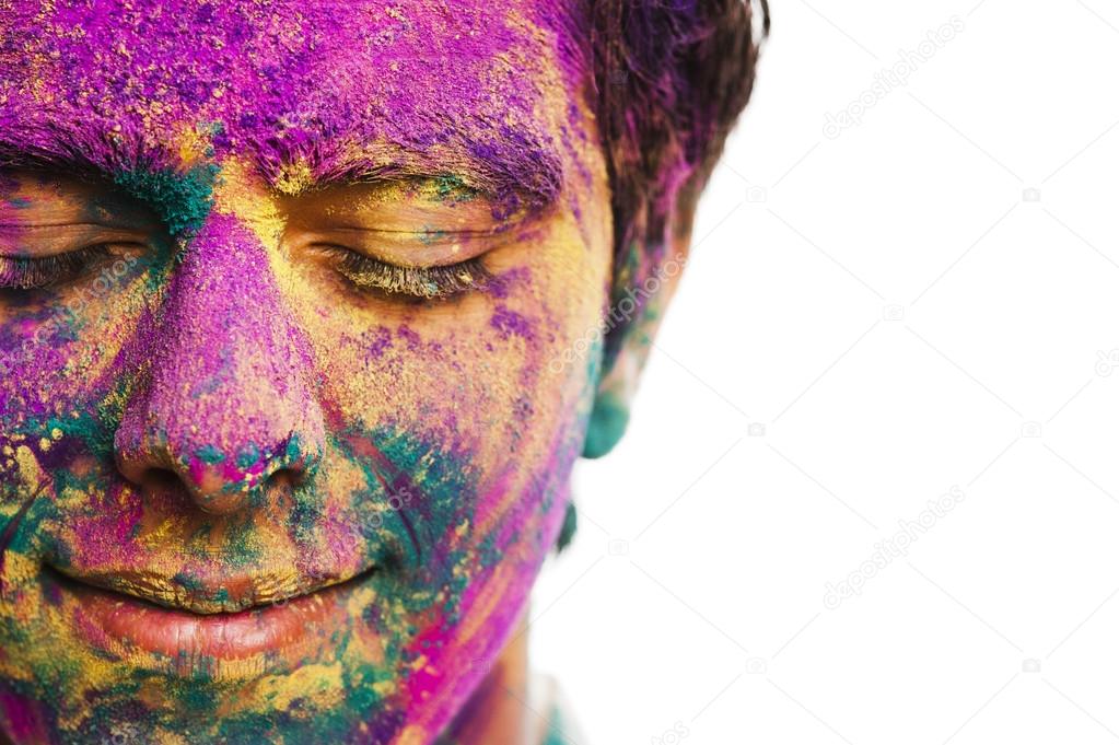Mans face covered with powder paint