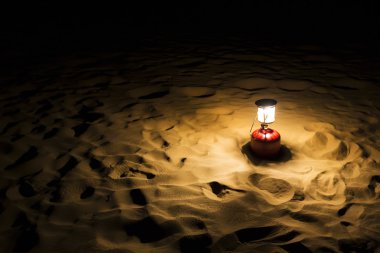 Lantern on sand dune clipart