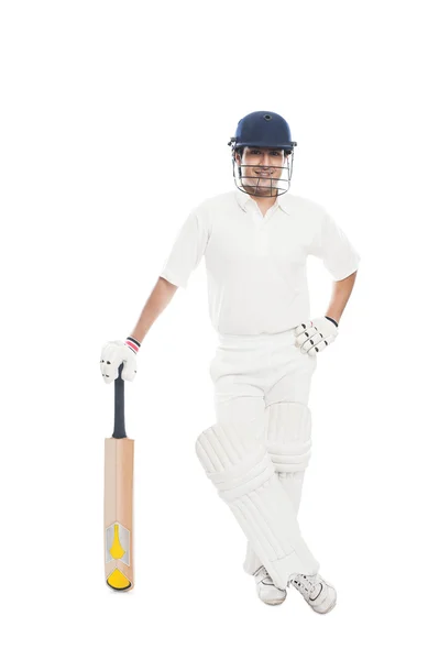 Bir kriket sopası ile duran topa vuran oyuncu — Stok fotoğraf