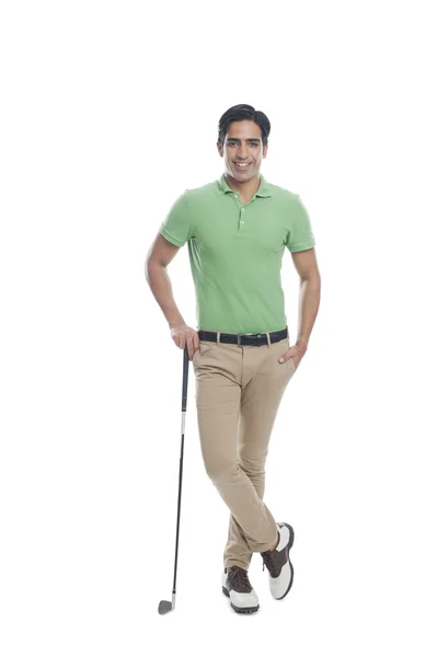 Male golfer standing with a golf club — Stock Photo, Image