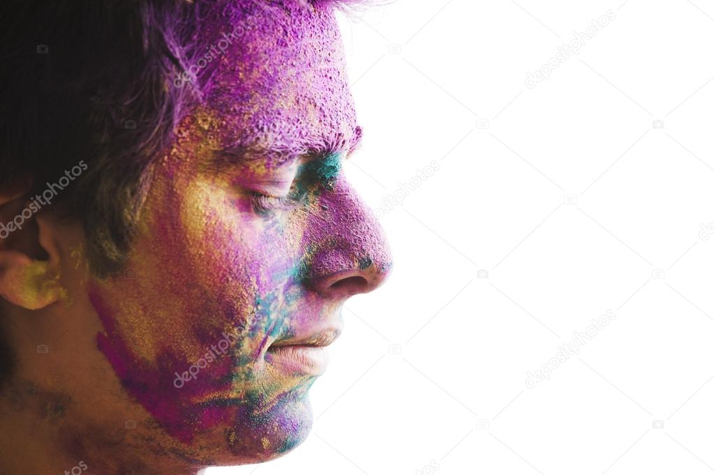 Mans face covered with powder paint