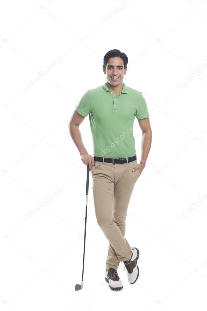 Male golfer standing with a golf club