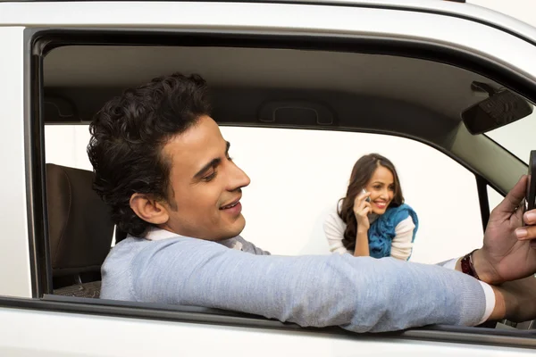 Man sitting in a car — Stock Photo, Image