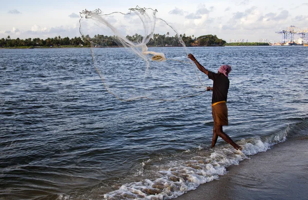 Fisherman fishing in the sea — Stock Photo, Image