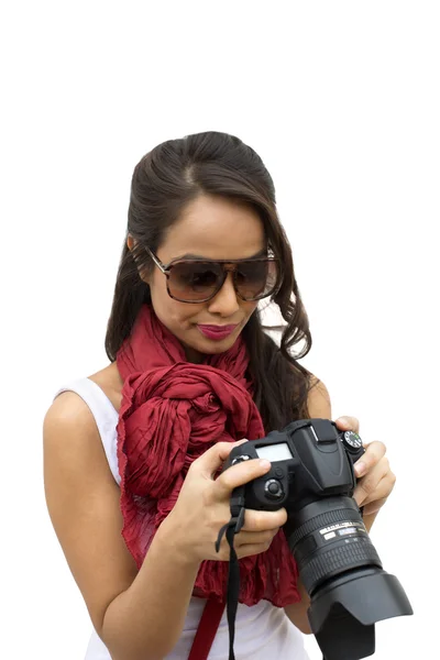 Female photographer holding a camera — Stock Photo, Image