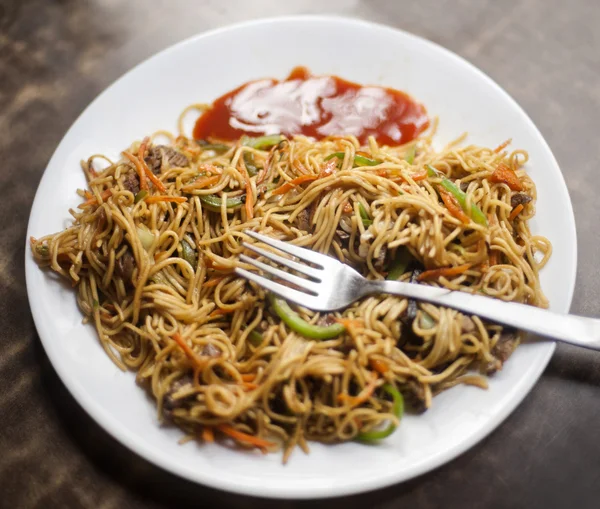 Plate of chow mein, Tibetan Market, Delhi, India Stock Image