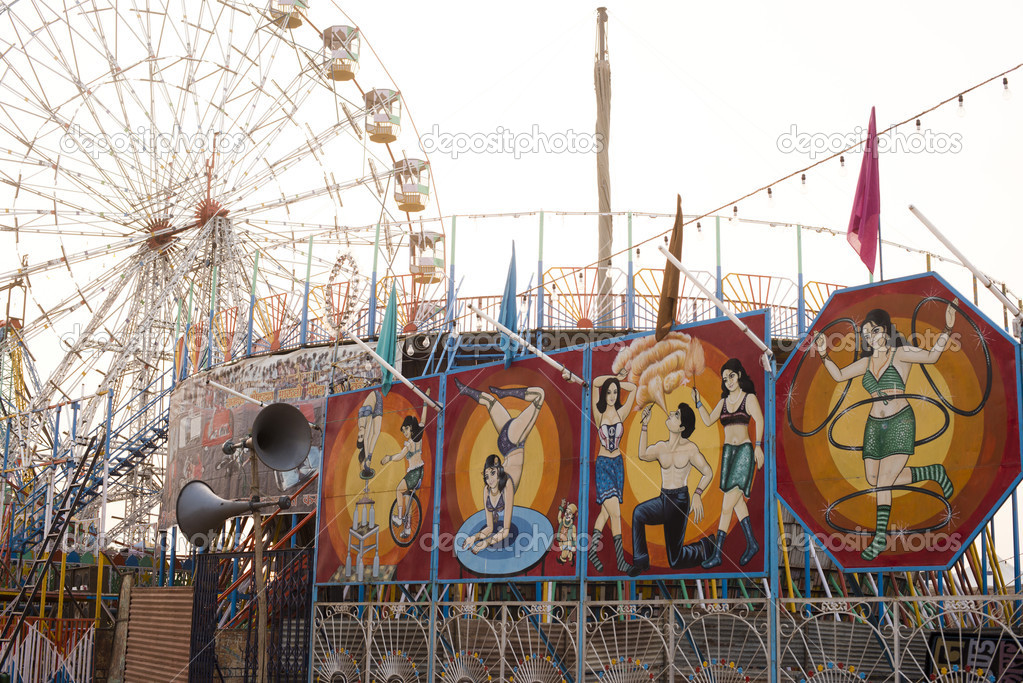 Sign boards of a circus and ferris wheel