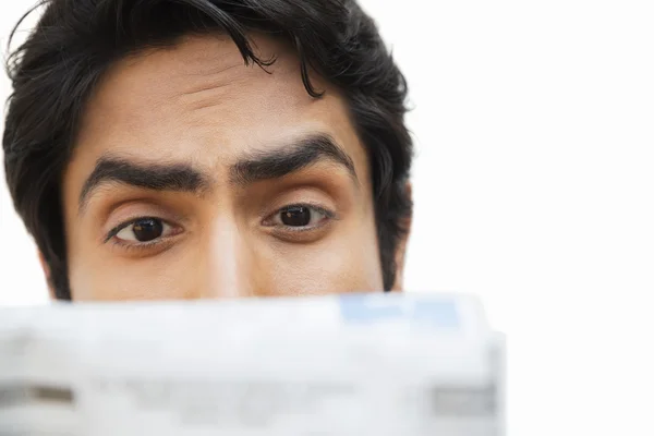 Businessman reading a newspaper — Stock Photo, Image