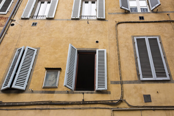 Low angle view of windows of a building, Siena, Siena Province, Tuscany, Italy