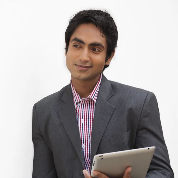 Businessman holding a digital tablet — Stock Photo, Image