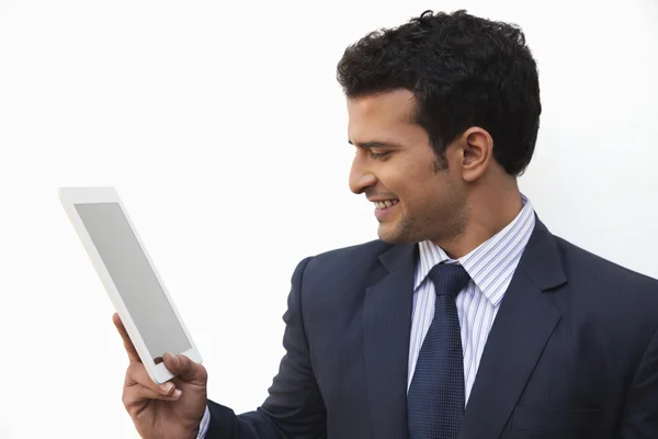 Businessman looking at a digital tablet — Stock Photo, Image