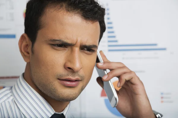 Businessman talking on a mobile phone — Stock Photo, Image