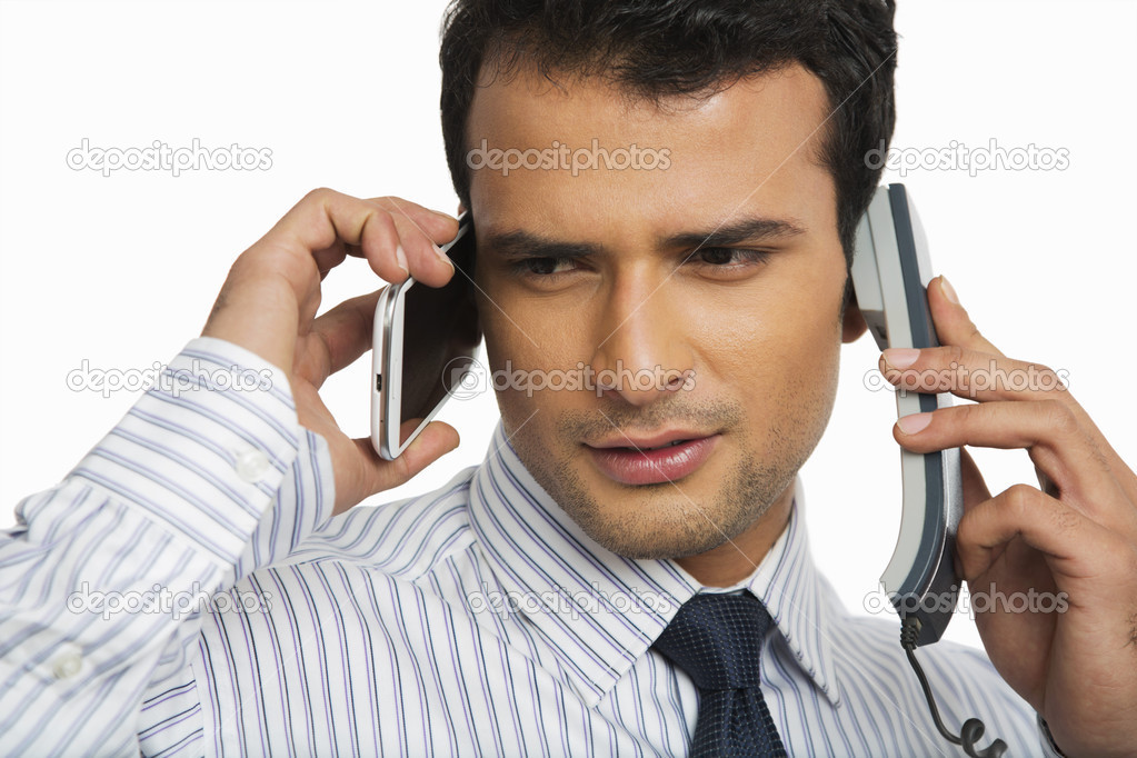 Businessman talking on phones