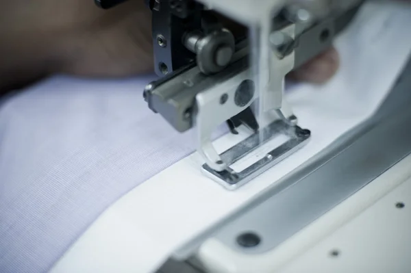 Cloth being stitched on the sewing machine — Stock Photo, Image