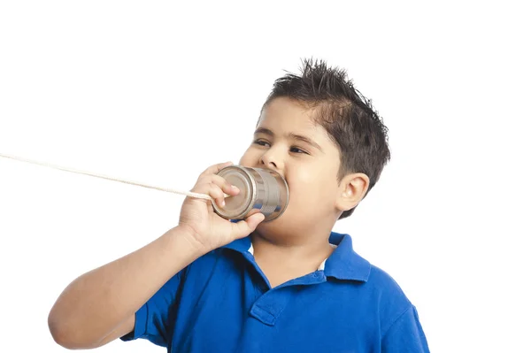 Close-up of a boy calling into a tin can phone — Stock Photo, Image