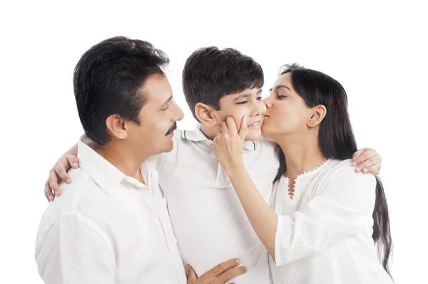 Couple kissing their son — Stock Photo, Image