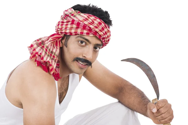 Portrait of a farmer holding a sickle — Stock Photo, Image