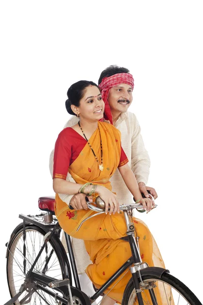 Couple riding a bicycle — Stock Photo, Image