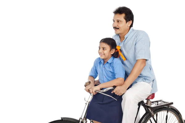 Man with his daughter on a bicycle — Stock Photo, Image