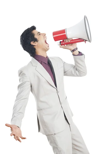 Biznesmen krzyczący do megafonu — Zdjęcie stockowe