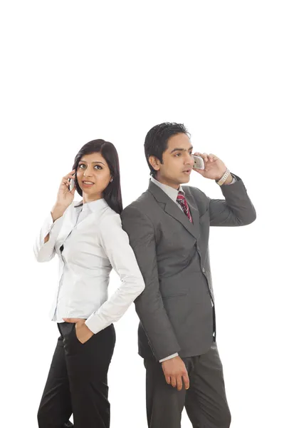 Business executives talking on mobile phones — Stock Photo, Image