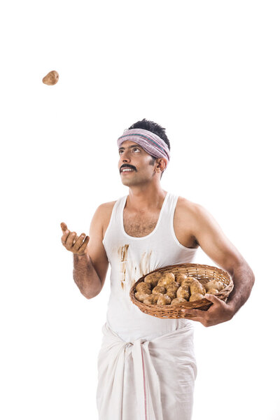 Farmer tossing a potato