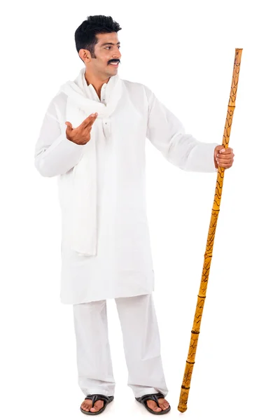 Man holding a wooden staff and gesturing — Stock Photo, Image