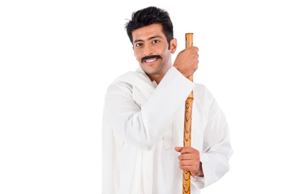 Portrait of a man holding a wooden staff — Stock Photo, Image