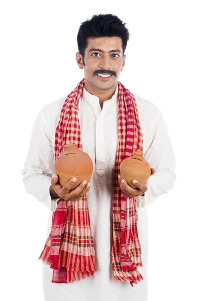 Portrét muže s prasátko v obou rukou — Stock fotografie